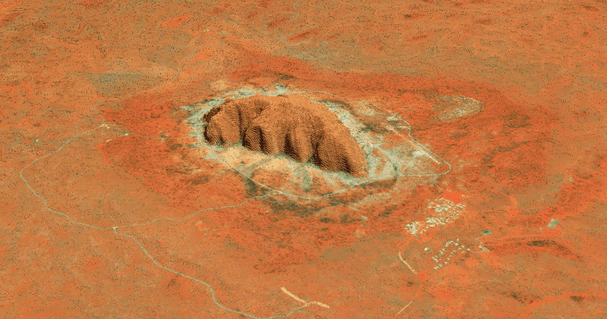 [Uluru Inselberg](http://bl.ocks.org/vincentsarago/raw/baa945af223caad62d088e4dde261d9f/#13.39/-25.33761/131.04674/44.1/53) (also known as Ayers Rock), Australia.