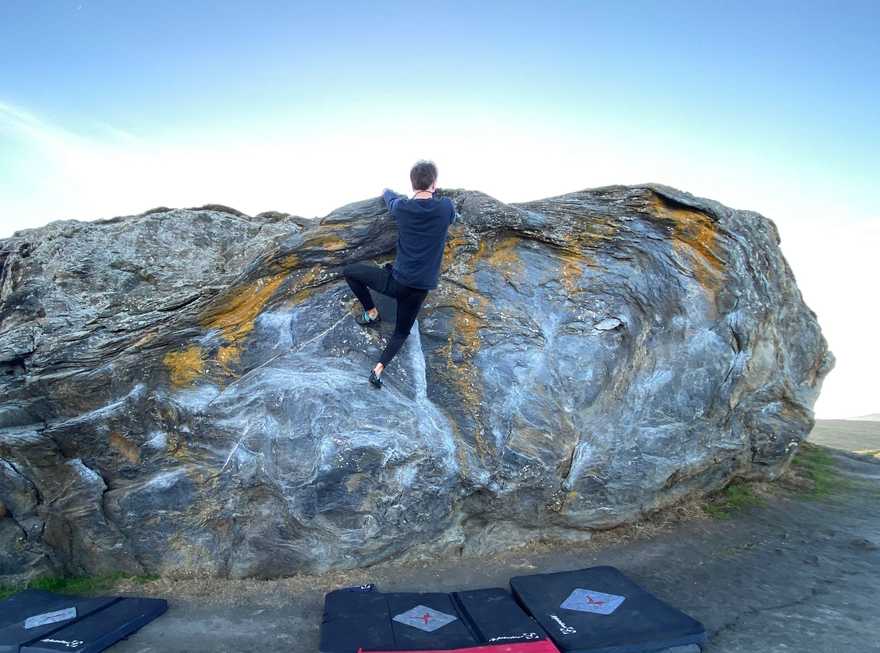 Ryan climbing Turtle Rock boulder in Marin County