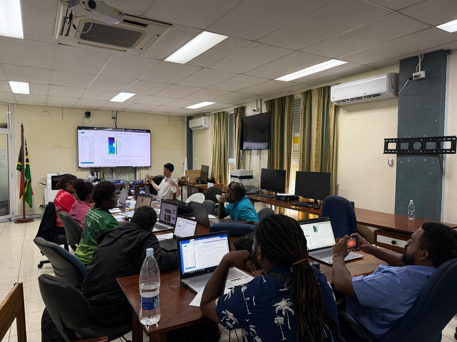 Wei Ji presenting the climate indicators lesson to a group of VBoS staff.